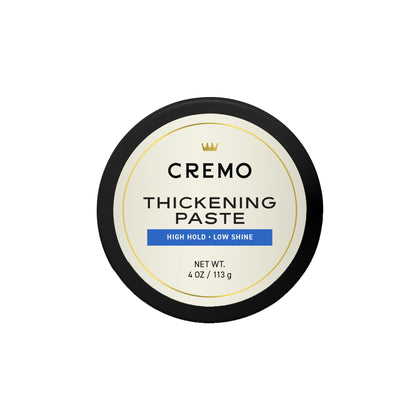 Cremo jar front view showing label and 4 oz size, highlights professional barber quality