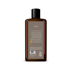 Cremo 16 fl oz bottle beside everyday items for size and value benefit