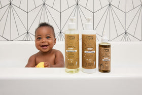 Cristina's Curls bottles beside a hand for size scale and easy storage benefit