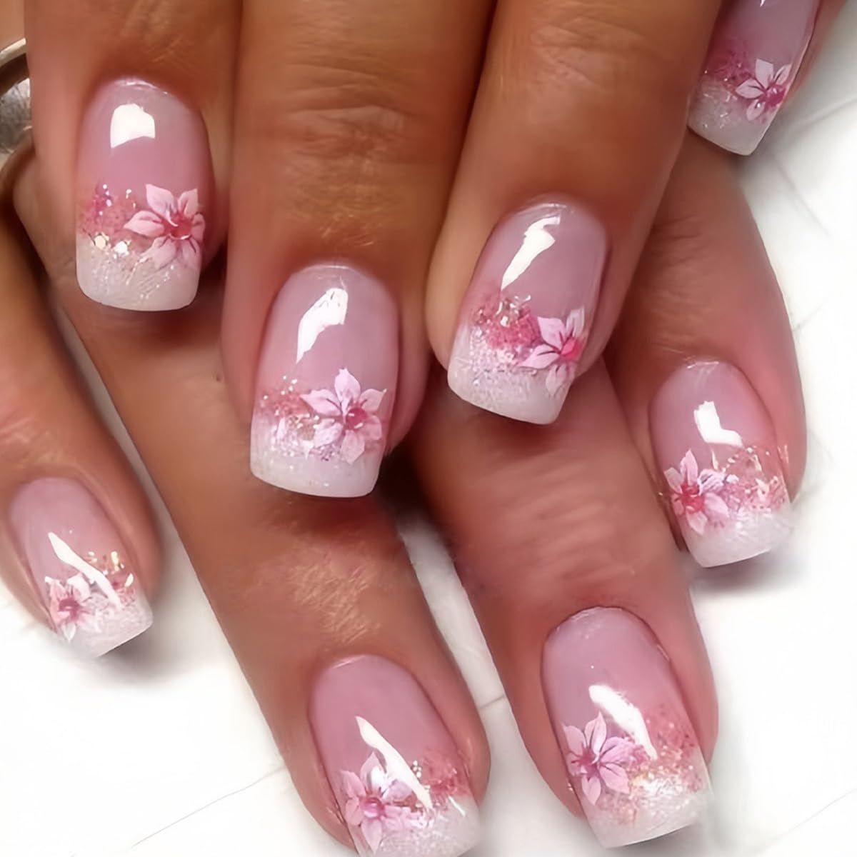 CTTHNBD close-up of floral French-tip detail highlighting durable acrylic finish
