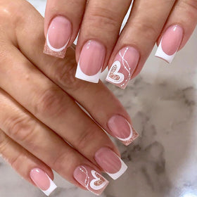 CTTHNBD hand applying a press-on nail for quick at-home styling