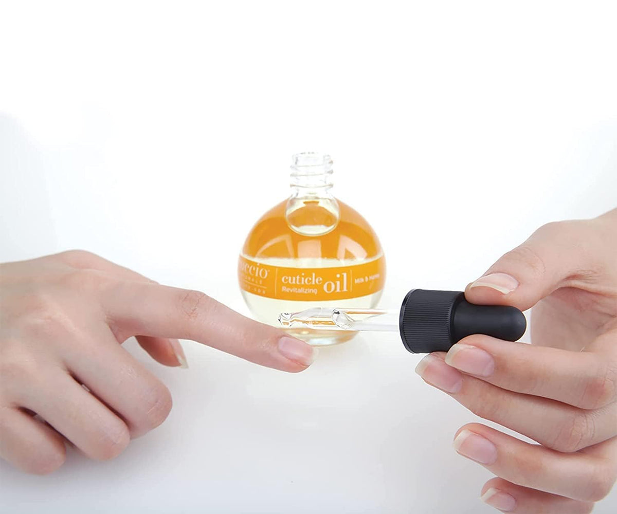 Cuccio bottle beside manicure tools promoting salon‑quality at‑home nail care