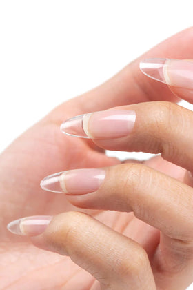 Cuccio gel texture pouring from brush to show self-leveling consistency