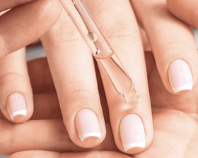 Cuccio travel roller in purse illustrating on-the-go cuticle nourishment