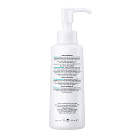 Curel cleansing oil on bathroom shelf with towels, suggests gentle daily use