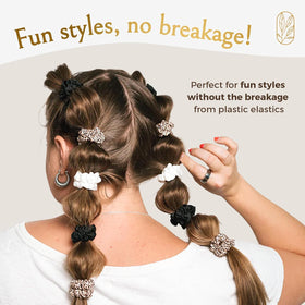Curlfriend Collective scrunchies on pillow in sleep setup illustrating crease-free overnight care