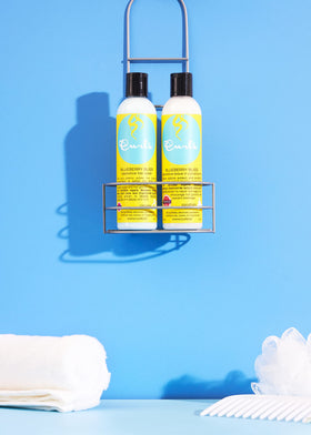 Curls Blueberry Bliss before and after detangling showing reduced frizz