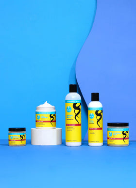Curls Blueberry Bliss in use styling edges on Type 4 hair for long-lasting control