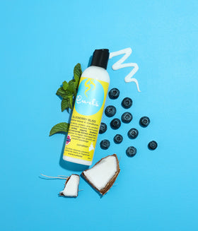 Curls Blueberry Bliss ingredient closeup with blueberries highlighting antioxidants