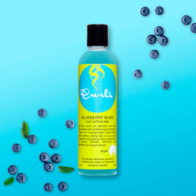 Curls Blueberry Bliss ingredient label displaying blueberry, argan, and aloe benefits