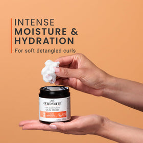 CURLSMITH being smoothed into damp curls to add moisture and reduce frizz
