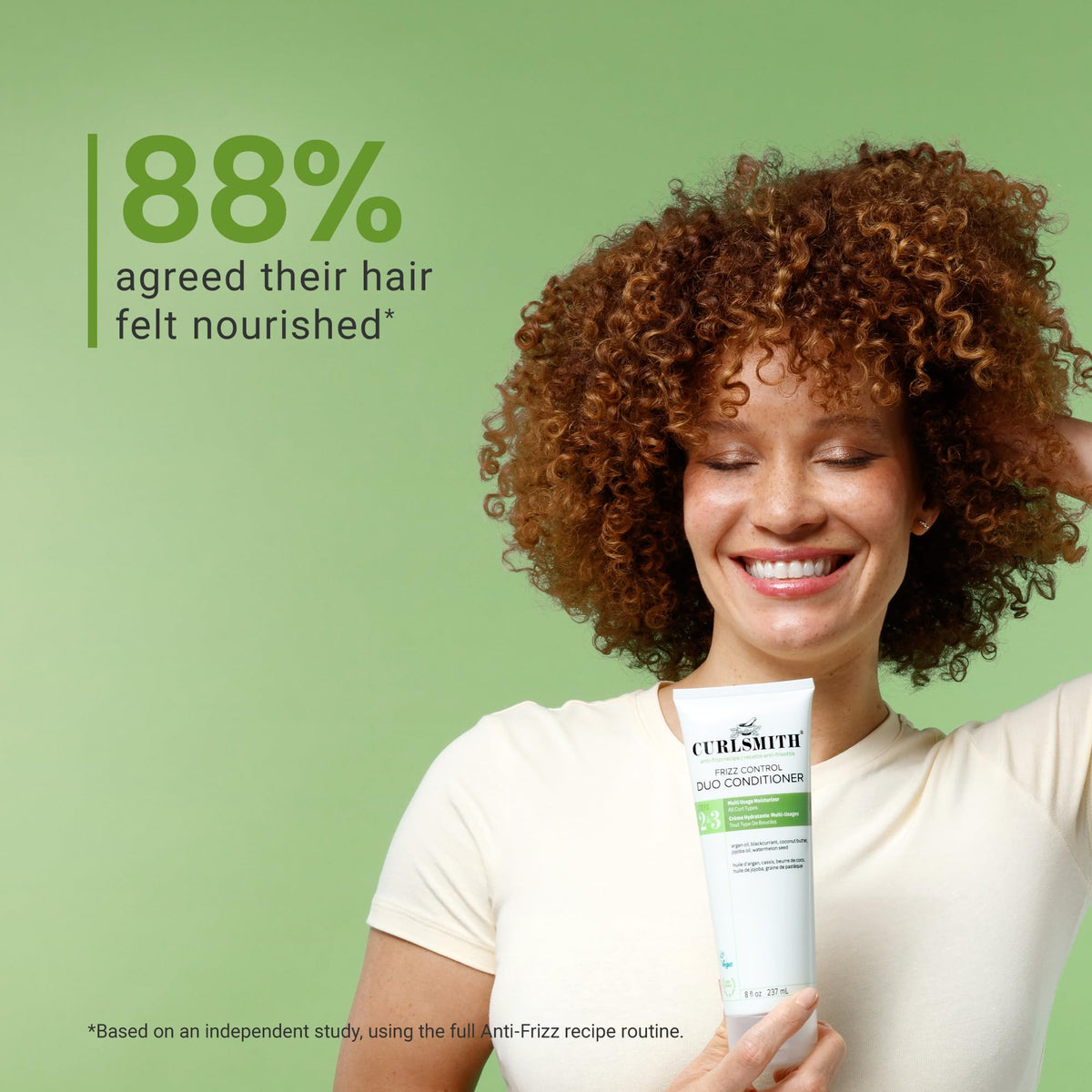 CURLSMITH model on beach with defined curls demonstrating humidity resistance