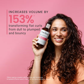 CURLSMITH bottle beside natural ingredient visuals to suggest clean formula