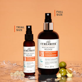 CURLSMITH bottle beside other products illustrating layering in routine