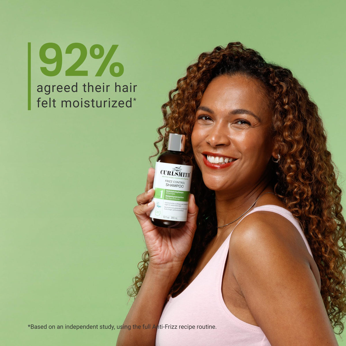 CURLSMITH product staged with curly hair to show real-life frizz control results