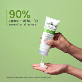 CURLSMITH product in hand showing 8 oz scale for purchase clarity