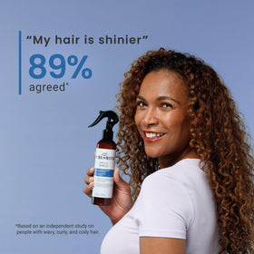 CURLSMITH mist applied to curly hair showing frizz control and resilience