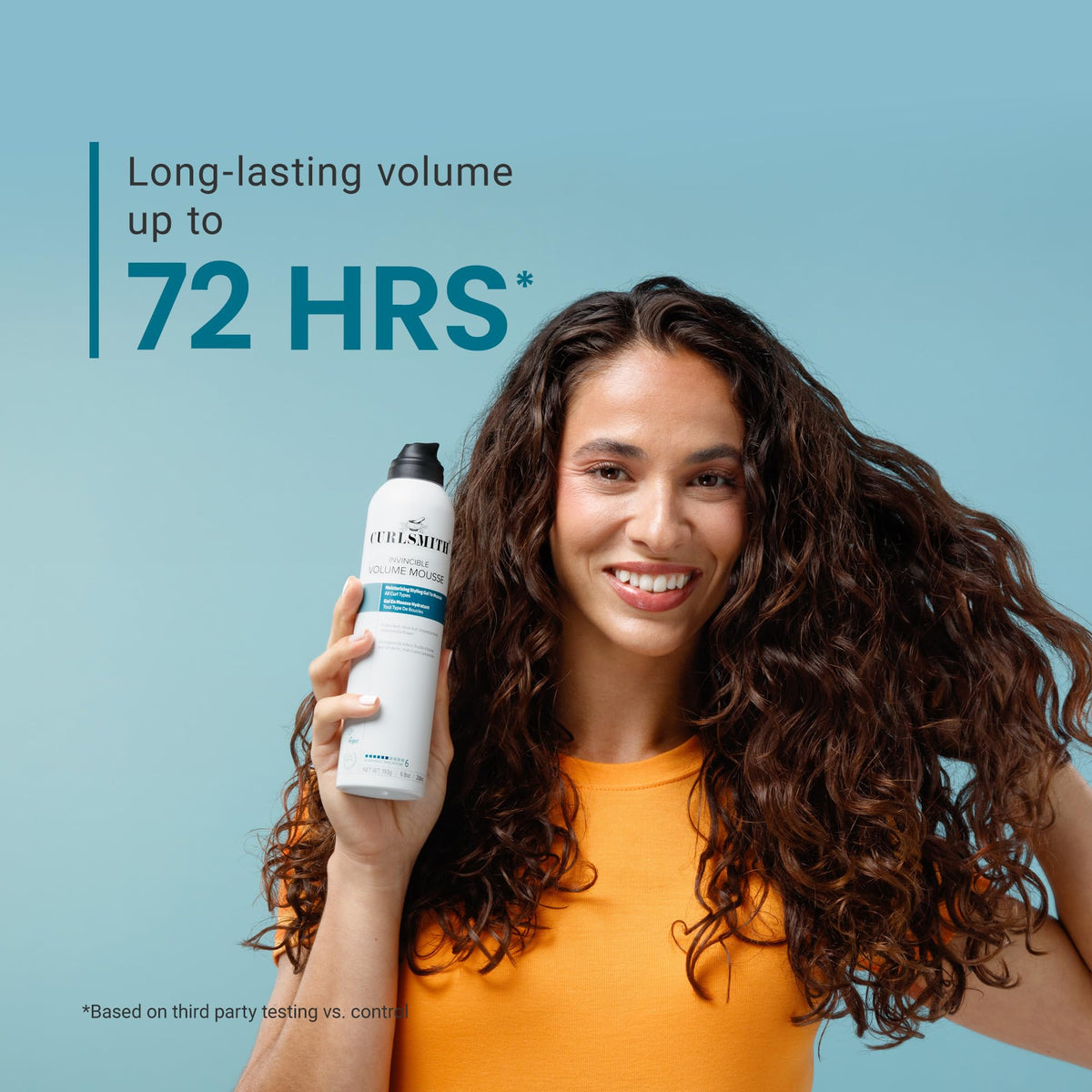 CURLSMITH applying mousse to curly hair for enhanced lift and bounce