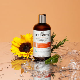 CURLSMITH shampoo and conditioner in bathroom lifestyle promoting complete system