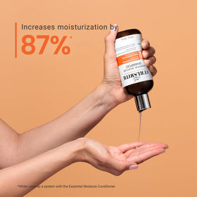 CURLSMITH bottle in hand illustrating 12 oz scale and portability benefit