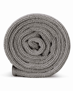Curly Girl towel placed in bathroom setup suggesting curated curl-care routine and ease