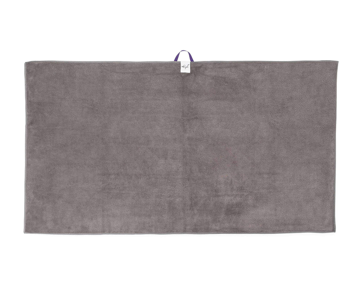 Curly Girl towel in use with woman wrapping curls to protect shape and speed drying