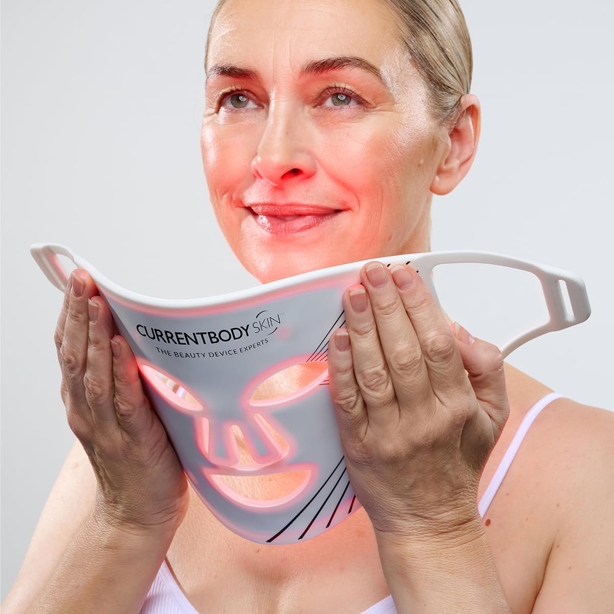 CurrentBody mask worn in-use on model illustrating hands-free treatment convenience benefit