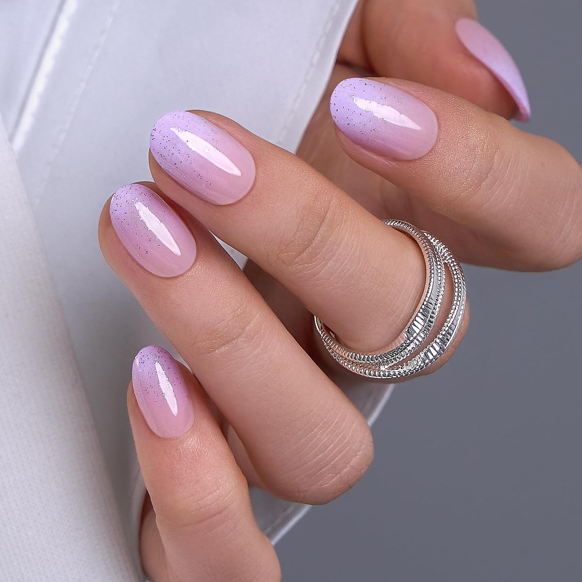 CurvLife kit contents with glue, adhesive tabs, file and cuticle stick for complete application