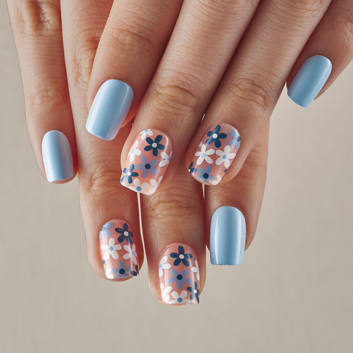 CurvLife model wearing azure blue floral nails showing polished appearance benefit