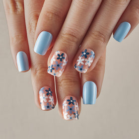 CurvLife model wearing azure blue floral nails showing polished appearance benefit