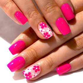 CurvLife close-up of pink flower pattern on nail tips highlights detailed floral look