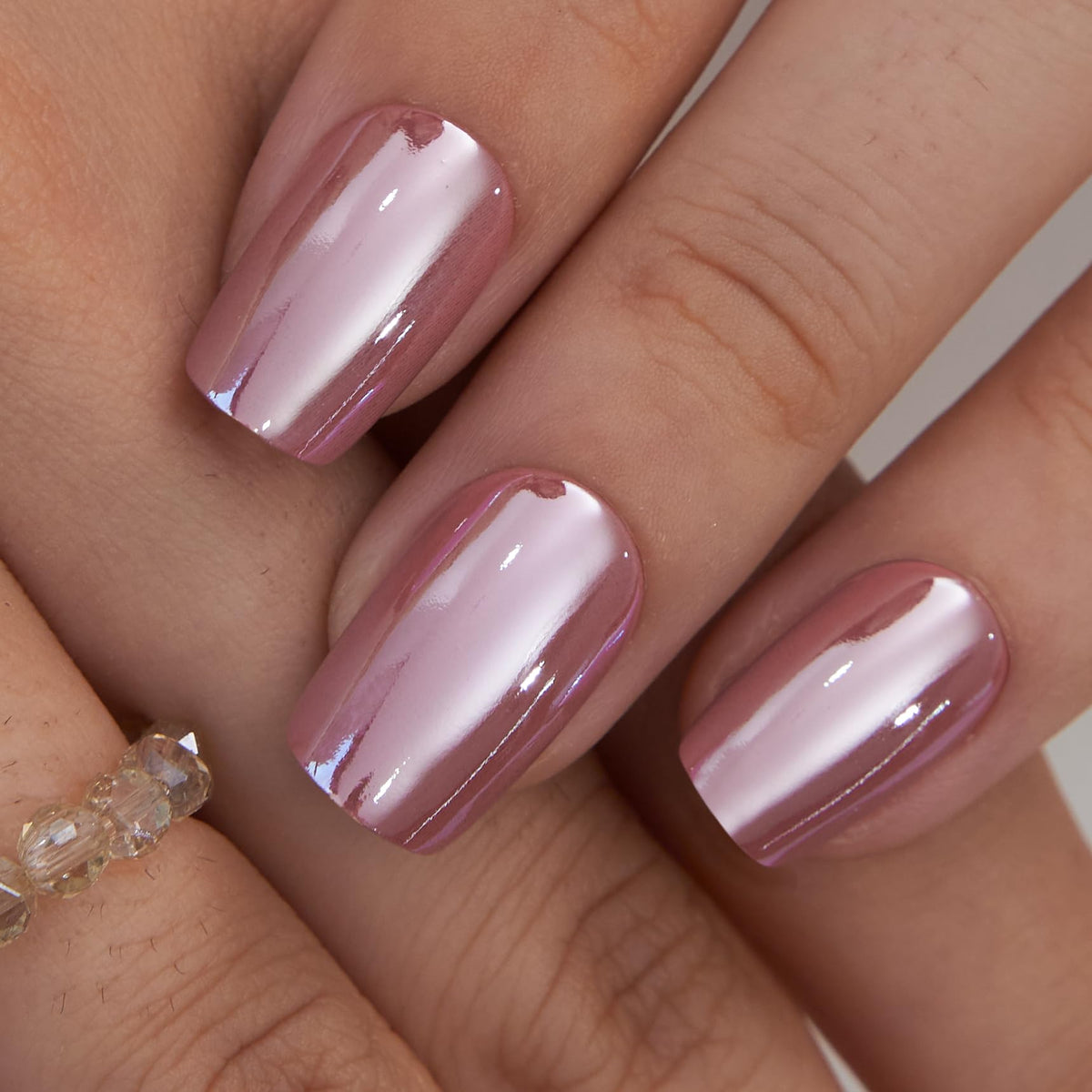 Curvlife close-up of pink glitter French tip detail highlighting artisan finish