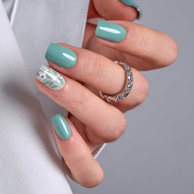 CurvLife front packaging showing green flower press-on nails and full kit for quick salon results
