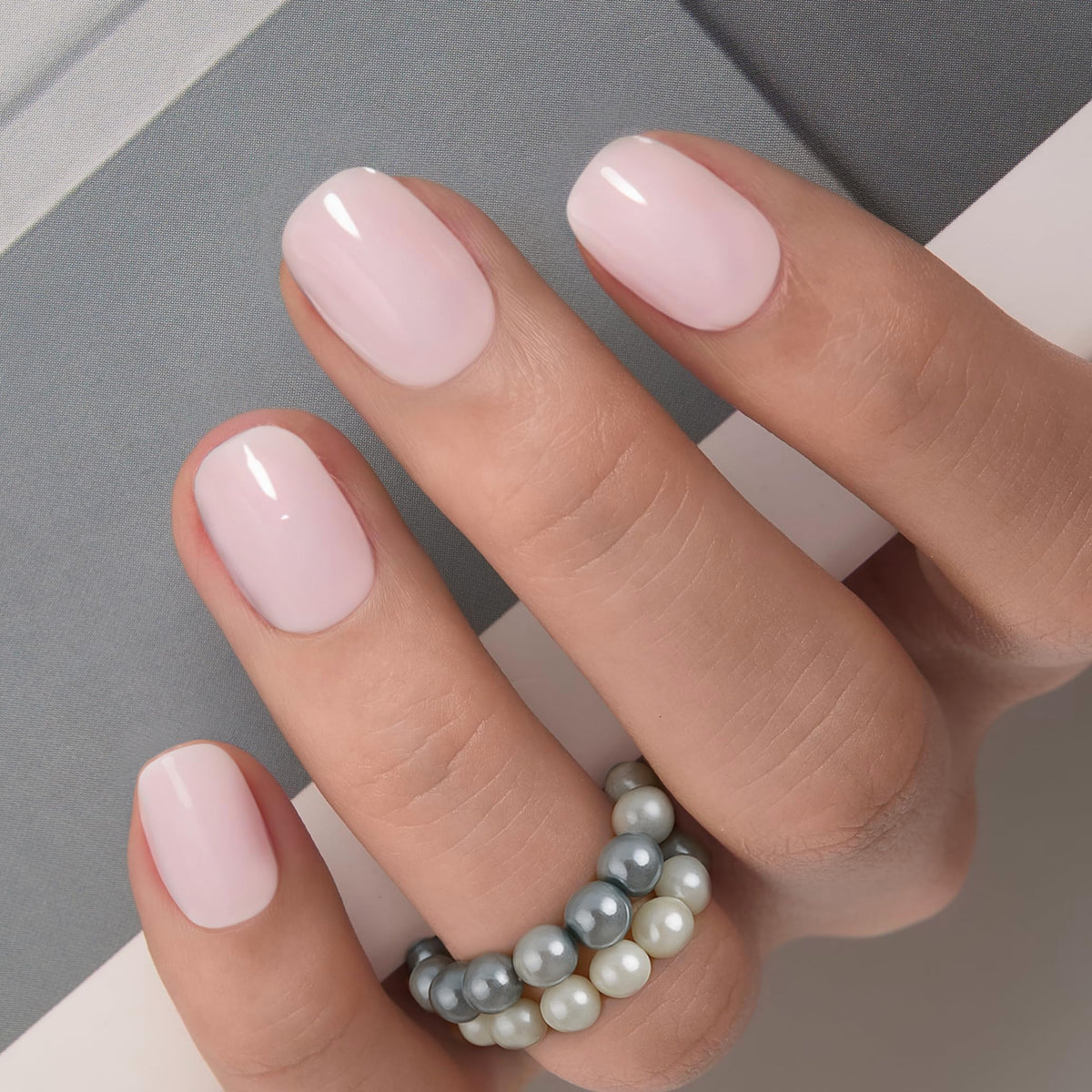 CurvLife front packaging showing milky white nails and apricot design for stylish wear