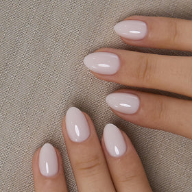 CurvLife front packaging showing milky white extra-short oval nails and 32-piece kit benefit quick salon look
