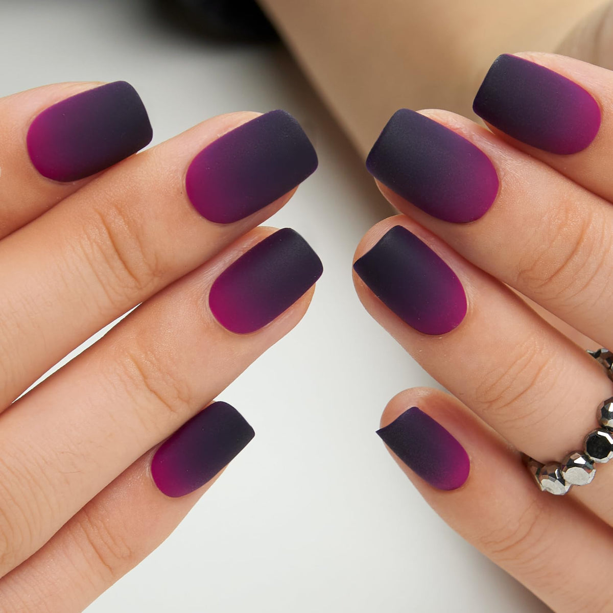 CurvLife on hand model displaying short square nails for a natural look