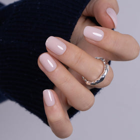 CurvLife in hand scale comparison illustrating size and realistic nail length benefit