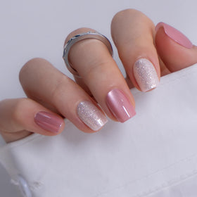 CurvLife nails held in hand showing scale and natural short square look