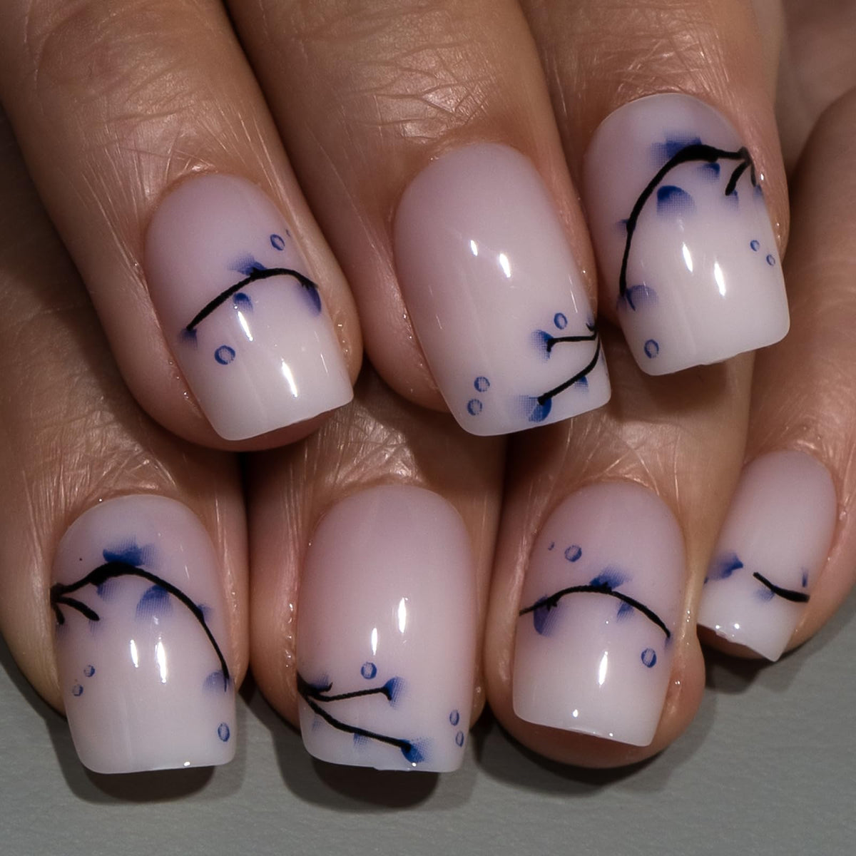 Curvlife lifestyle shot of woman with nails holding coffee showing polished style