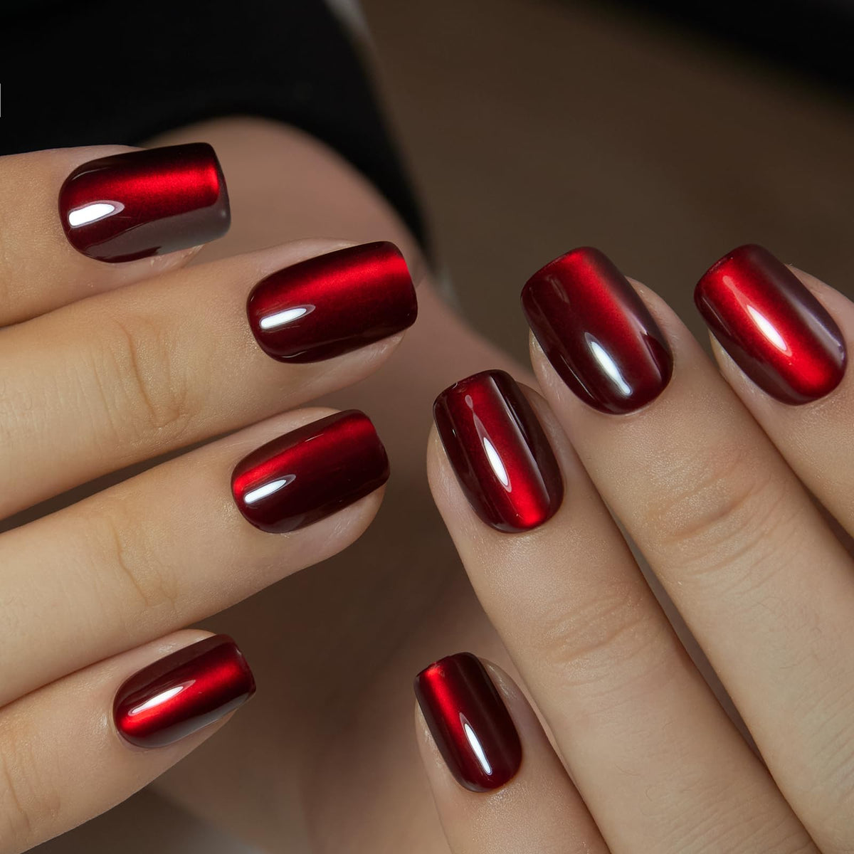 CurvLife nails in hand for scale showing comfortable, natural fit