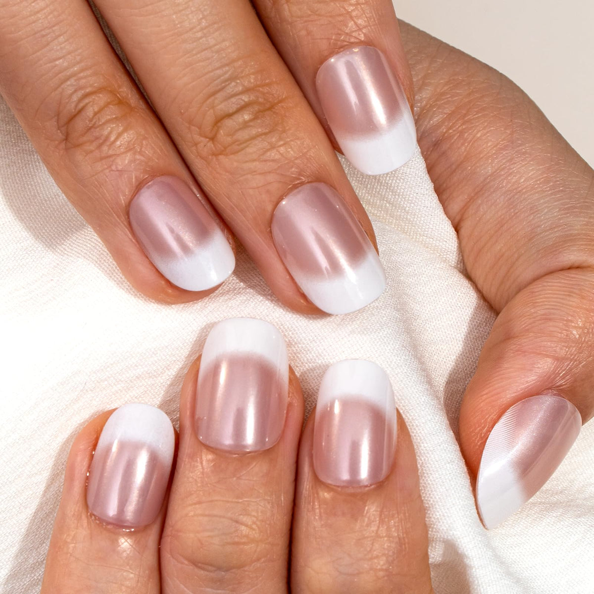 CurvLife scale shot of hand applying press-on nails for quick manicure