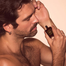 CYKLAR oil drop on skin showing smooth texture and long-lasting scent