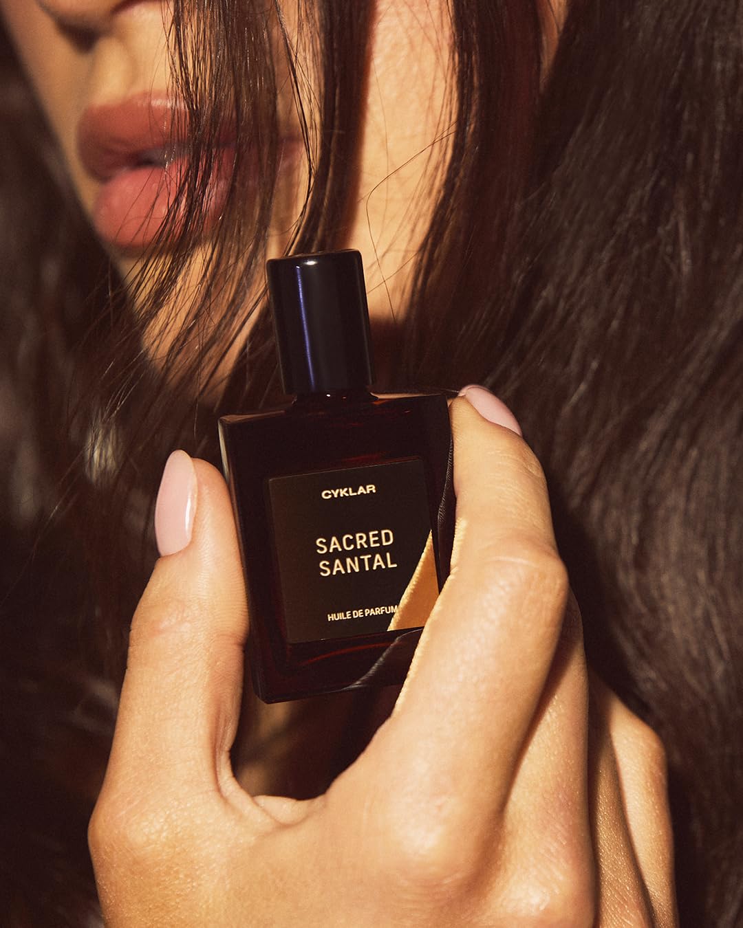 CYKLAR Sacred Santal on bedside table in evening setting suggesting warm sophisticated mood