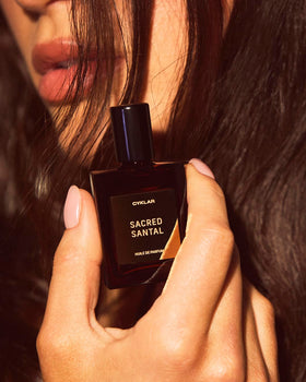CYKLAR Sacred Santal on bedside table in evening setting suggesting warm sophisticated mood