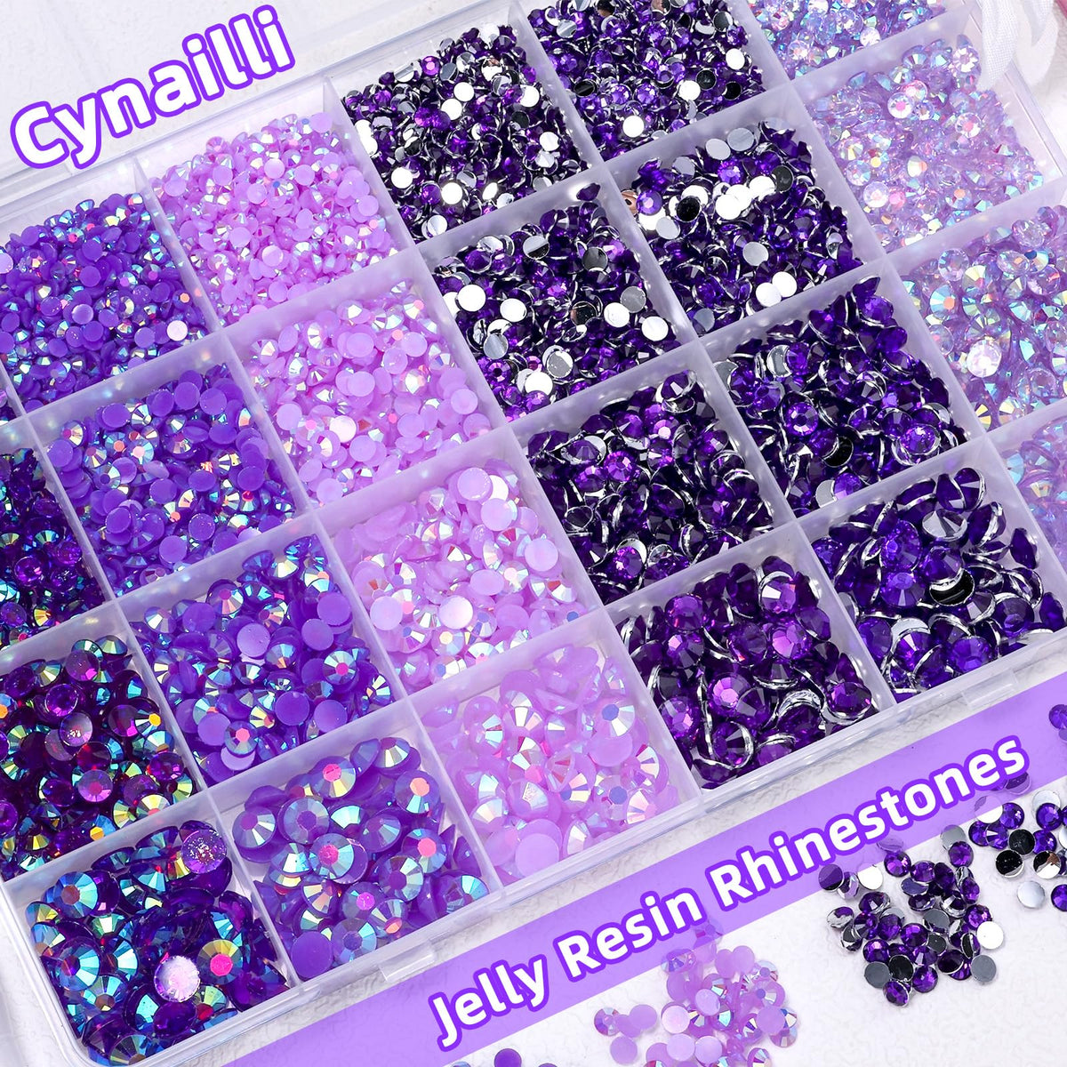 Cynailli tweezer and picking pencil placed beside gems for accurate application