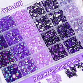 Cynailli tweezer and picking pencil placed beside gems for accurate application