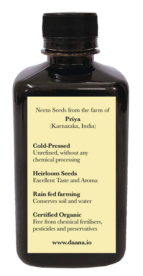 DAANA oil pouring from bottle into a spoon showing easy dispensing for DIY blends