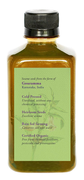 DAANA sesame oil pouring drops into hand demonstrating easy absorption and nourishment