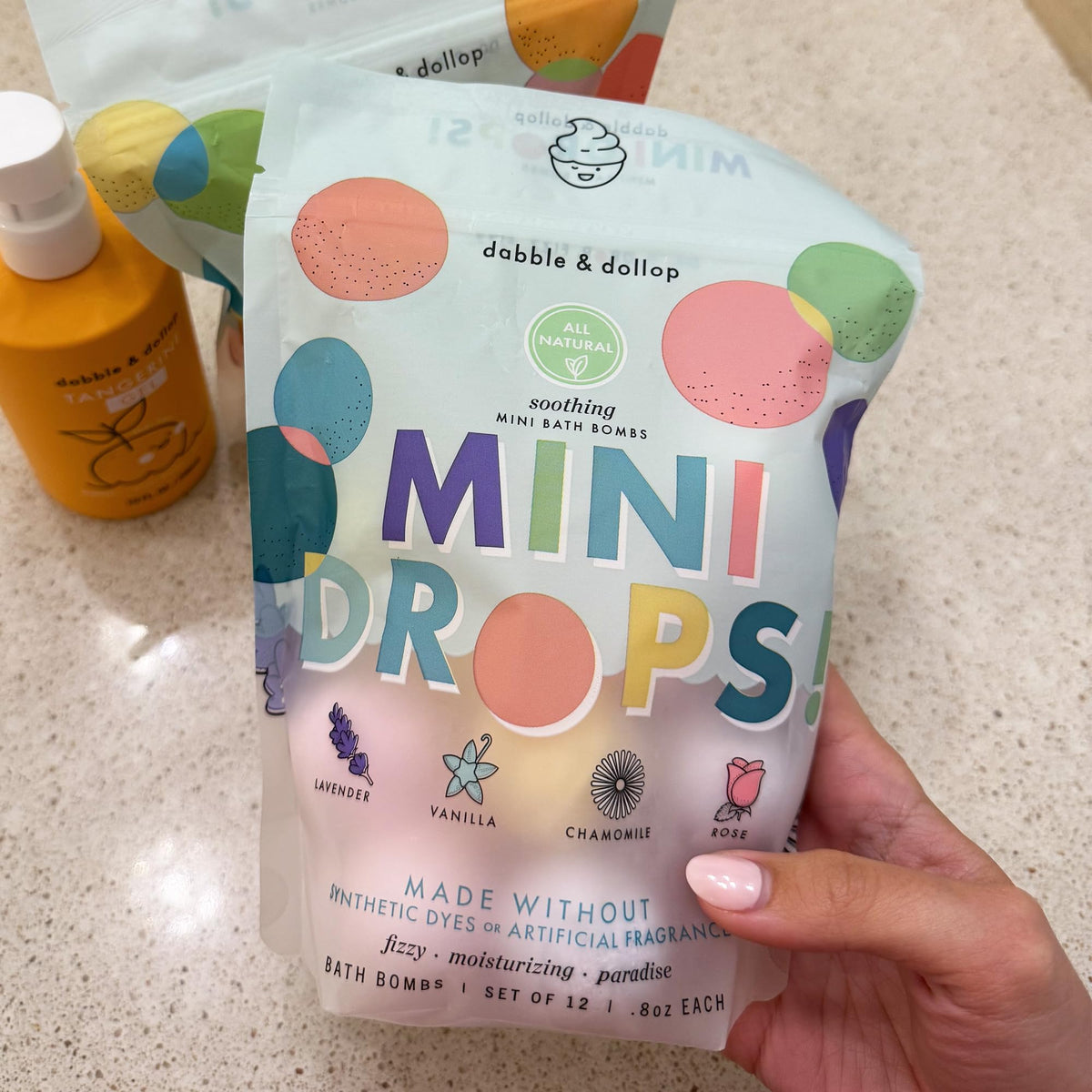 Dabble & Dollop bath bombs fizzing in tub during use for playful sensory benefit