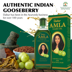 Dabur Amla Hair Oil with amla berries to show natural ingredient